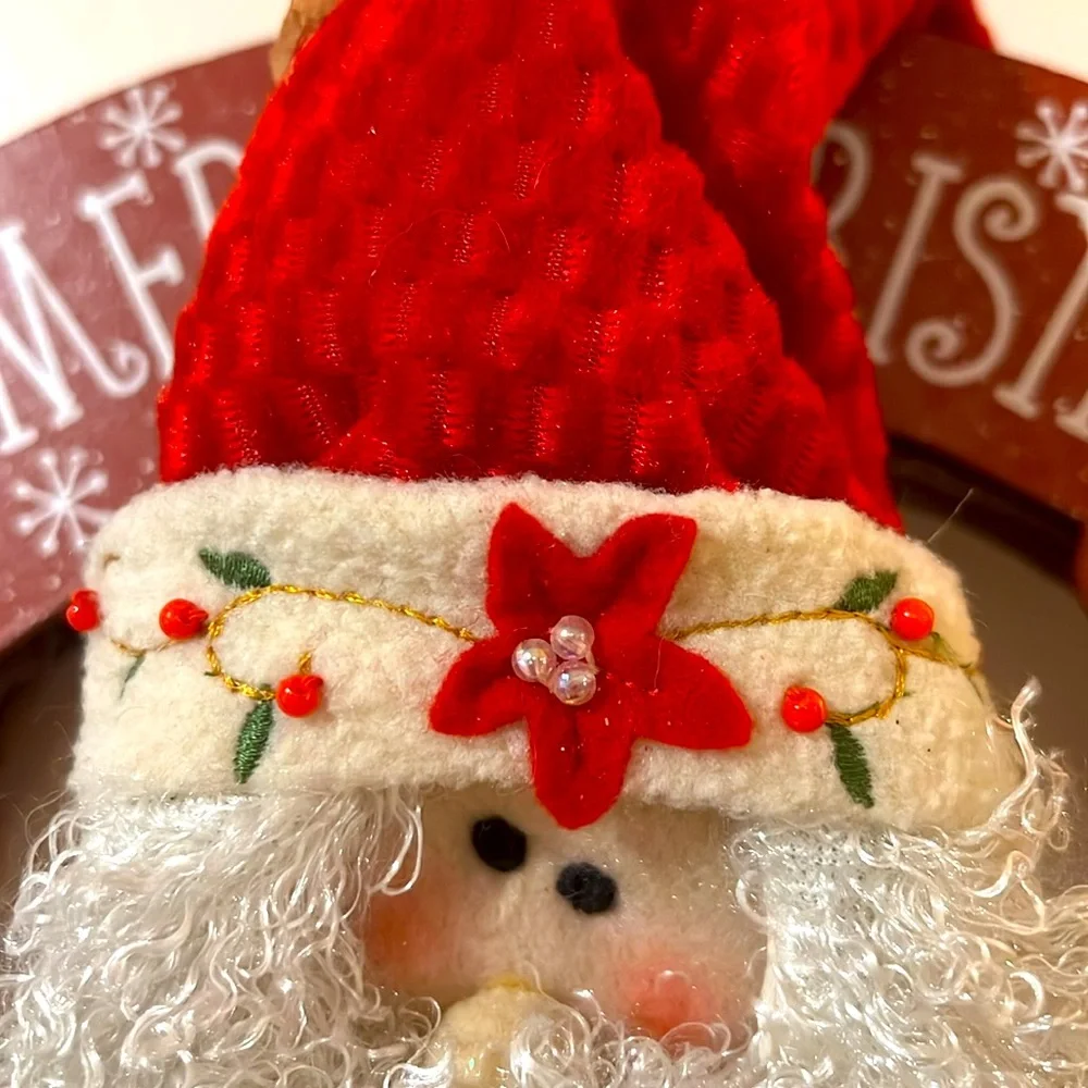Festive. Merry Christmas. Sitting Santa Claus on the Wooden Bench.